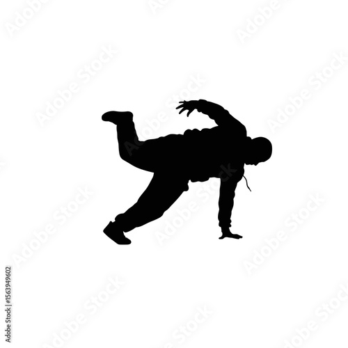 Breakdancing dancer performing a move in silhouette on white background  