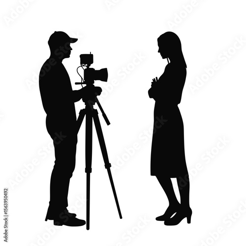 Photographer taking pictures of model in studio during photoshoot  