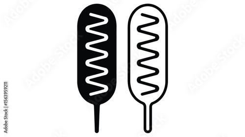 Two corn dogs one black and one white with zig zagging lines of sauce on a white background