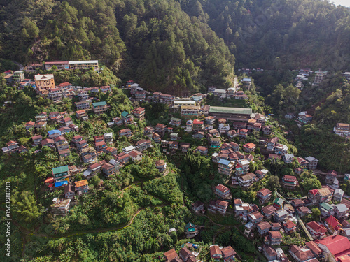 Aerial view of Barlig municipal houses, Mountain Province, Philippines, morning mist and sunrise