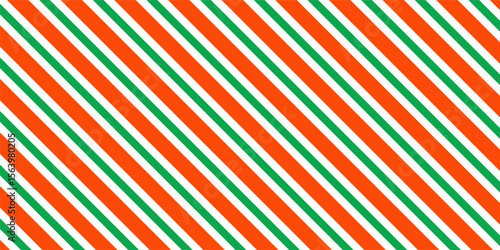 Christmas seamless pattern. Red and green diagonal stripes background. Candy cane repeating decoration wallpaper. Winter holiday lines backdrop. Xmas peppermint present wrapping print design. Vector