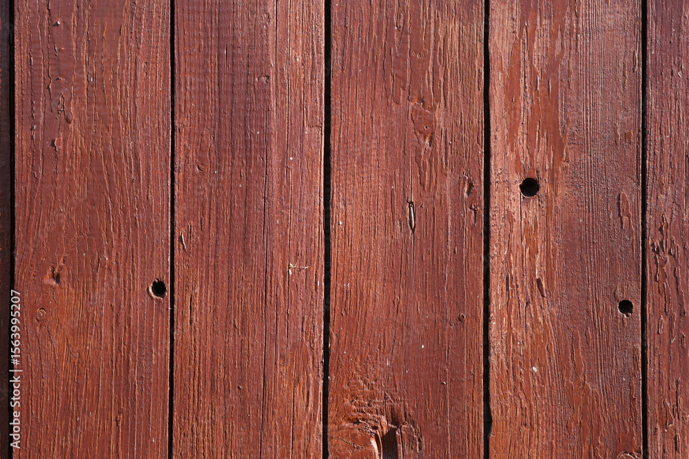 Naklejka premium Rustic Dark Red Wooden Planks with Visible Grain and Nails