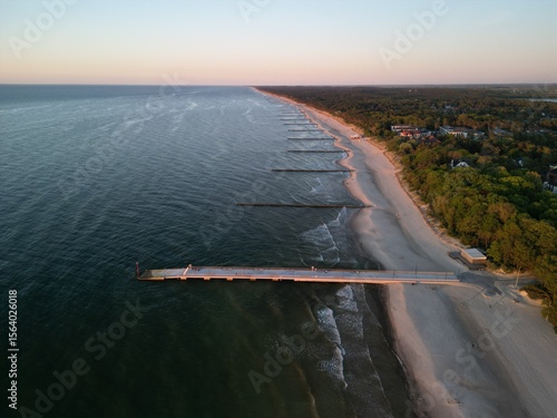 Niechorze - Polska - miasteczko nad Bałtykiem z latarnią morska i molo - zdjęcia z drona