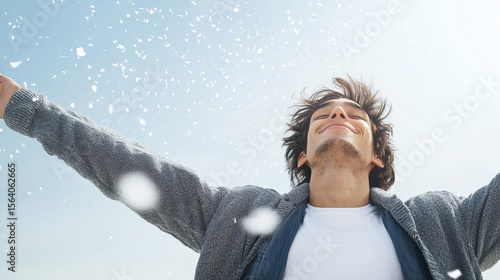 Joyful person with arms outstretched, feeling proud and free in snowy environment, radiating happiness and positivity