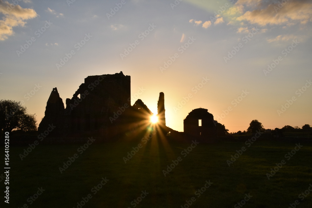 Obraz premium cong abbey village same name straddling sunset
