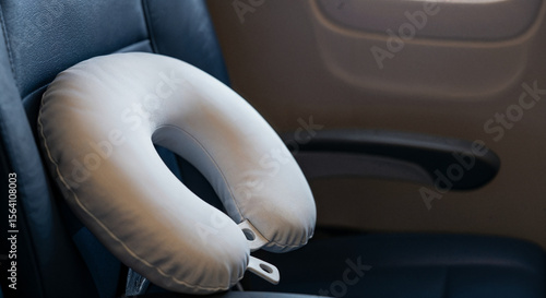 Travel Pillow Inside Aircraft Seat: Enhancing In-Flight Comfort and Neck Support for Passengers