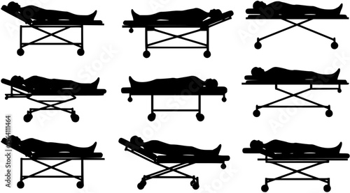 vector silhouette of a person lying on a gurney on a white background .
