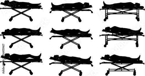 vector silhouette of a person lying on a gurney on a white background .
