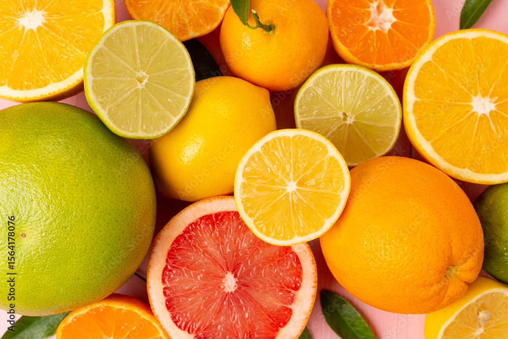 Fototapeta premium Different citrus fruits on wooden background, top view