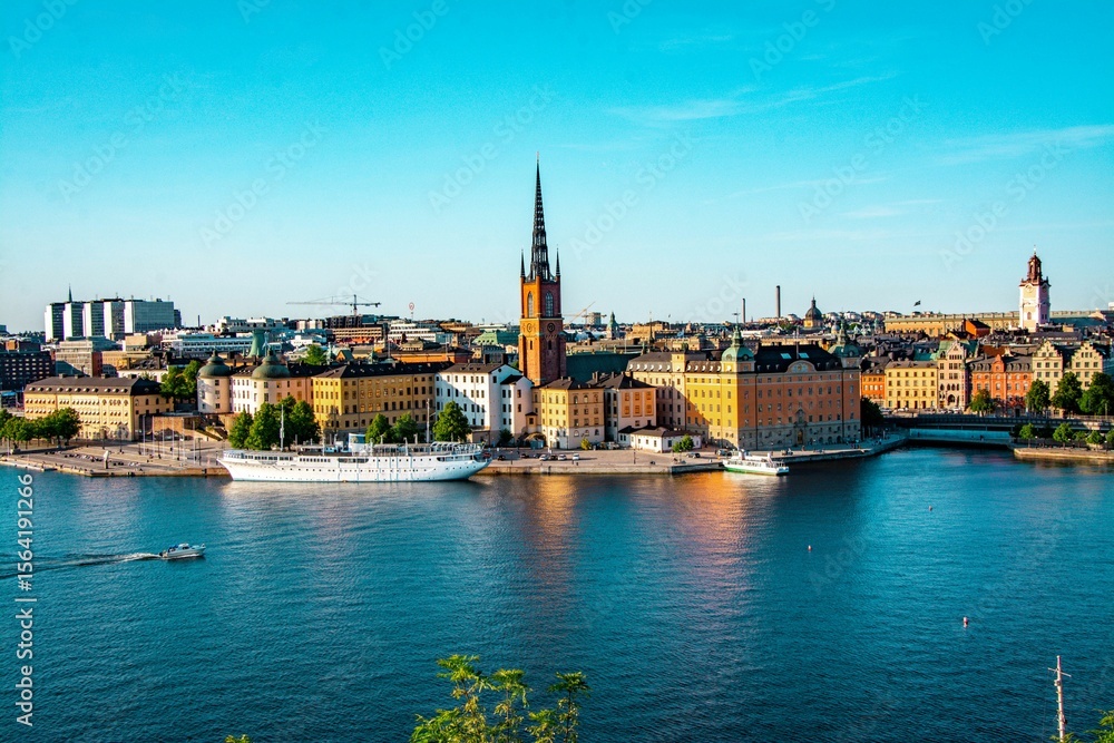 Fototapeta premium Panoramic view of Riddarholmen church and Stockholm's historic architecture and waterfront