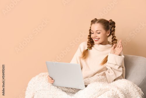 Happy young woman in warm s...