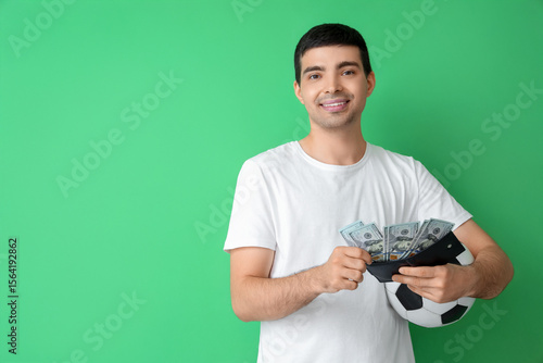 Happy young man with soccer...