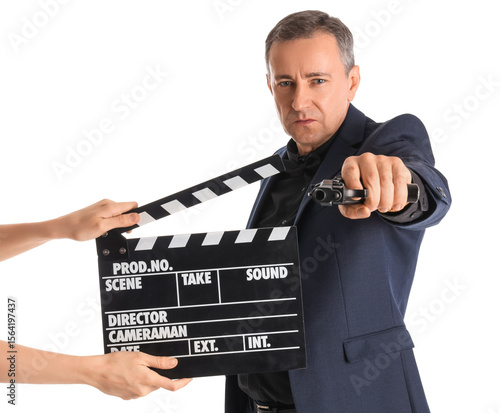 Mature actor holding gun an...