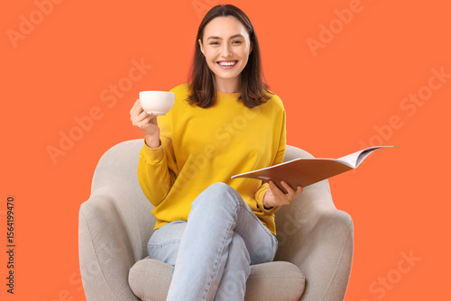 Young woman with cup of tea...