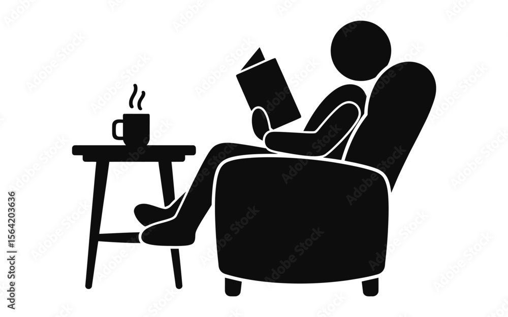 Person relaxing in armchair reading a book with a hot drink on a side table Person relaxing in armchair reading a book with a hot drink on a side table