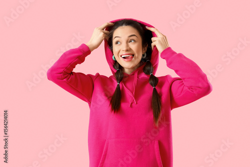 Stylish young woman in hood...