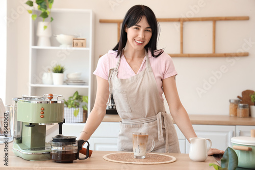 Smiling young woman in apro...