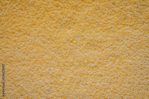 Close up detail of yellow wool fabric texture