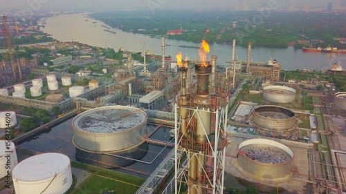 Aerial view of an oil refinery plant with flames burning