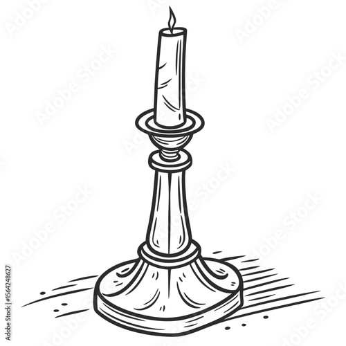 Ornate candlestick with lit candle flame vintage
