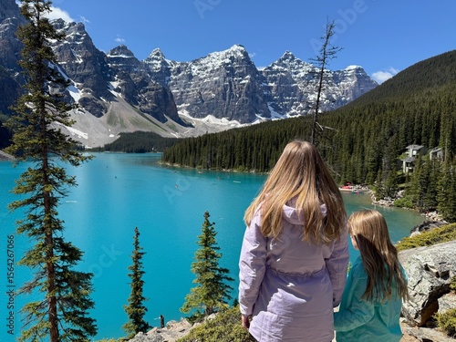 Wallpaper Mural Woman and girl standing in front of turquoise Moraine Lake and mountains in Banff Torontodigital.ca