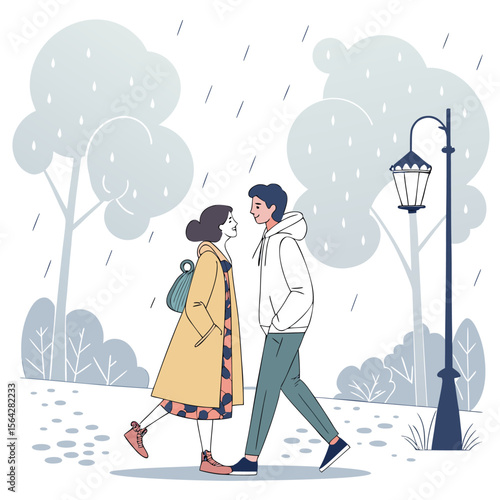 A young couple walks together in the rain on a park path looking at each other affectionately near a lamppost and trees