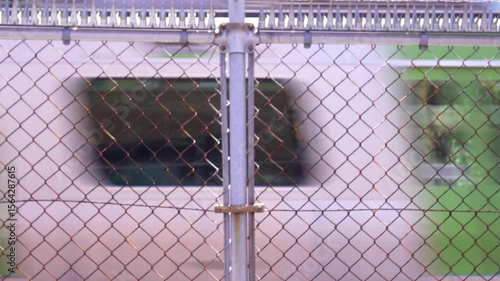 Urban Scene with Yamanote Line Passing Behind Fence