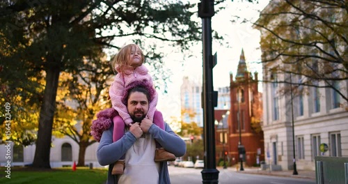 Wallpaper Mural Happy Father Carrying Daughter in Cozy City Walk – Wind in Her Hair and Joy in Her Smile Torontodigital.ca