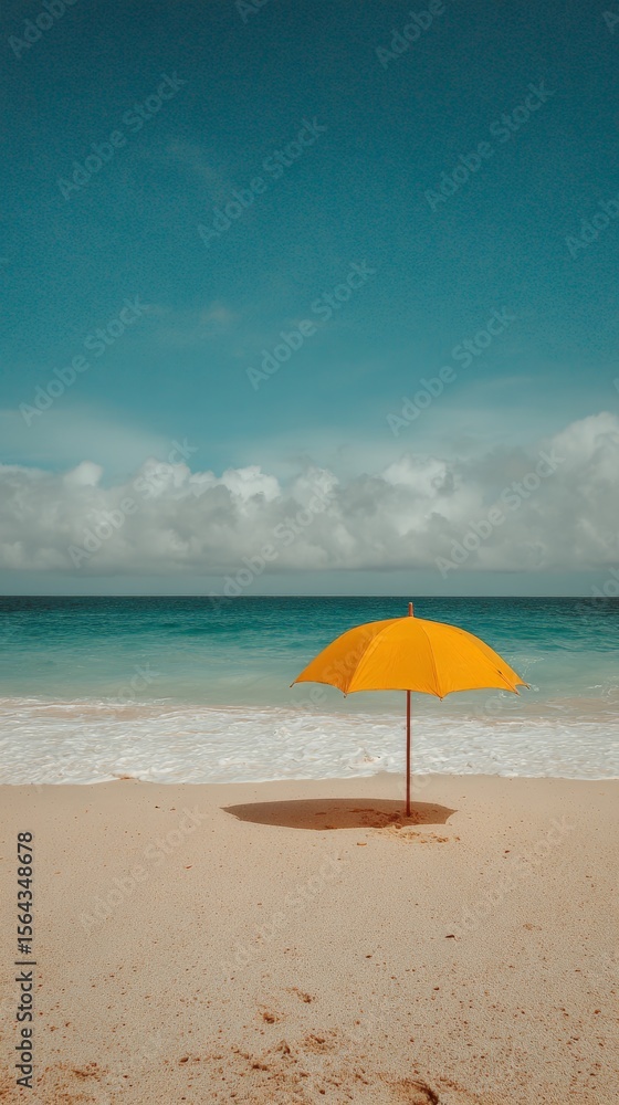 Solitary yellow umbrella on tranquil beach under clear blue sky Solitary yellow umbrella on tranquil beach under clear blue sky