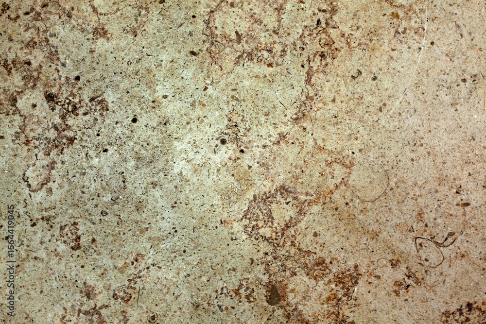 Fototapeta premium Showing rough beige and brown mottled stone surface in flat design, highlighting pits and speckles