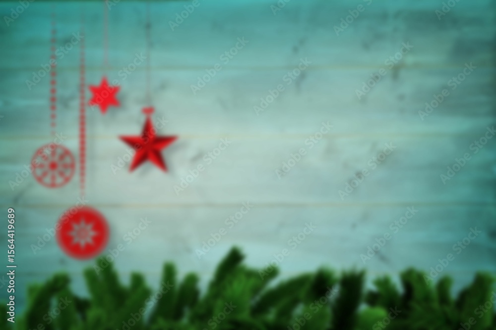Obraz premium Blurred christmas decorations hanging over wood