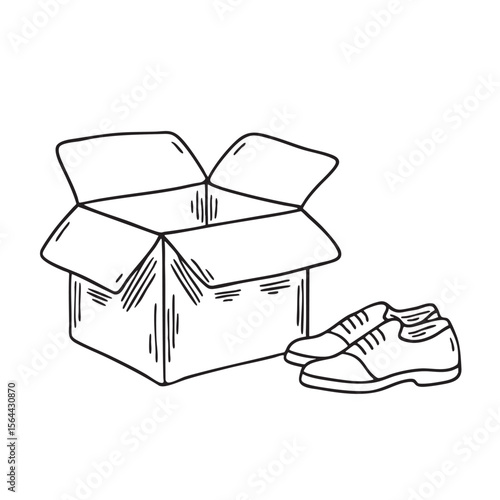 New shoes resting next to their opened box on the floor
