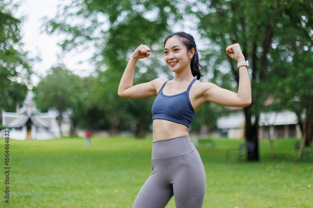 Slim athletic asian girl performs stretching for exercises outdoors in the park.
Slim athletic asian girl performs stretching for exercises outdoors in the park.