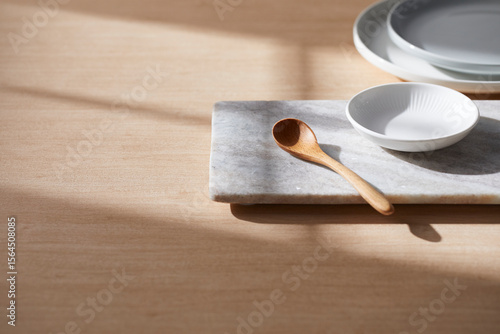 Light and Shadow on Wooden Texture with Modern Objects. Minimal Home Decor Scene with Ceramic Trays.