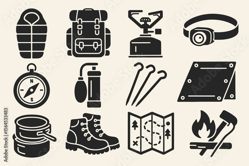 Essential camping gear: backpack, sleeping bag, compass, stove, boots, map, campfire tools