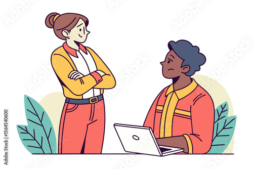 Two diverse colleagues discussing work while one works on a laptop in a modern office setting