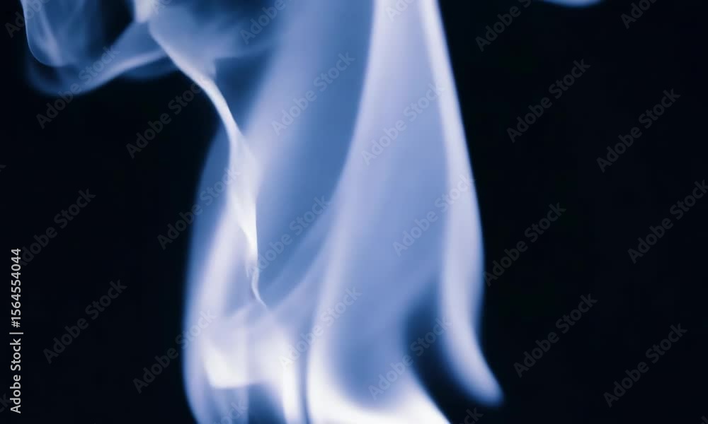 A swirling, monochromatic ethereal glowing abstract flame dances gracefully in the dark A swirling, monochromatic ethereal glowing abstract flame dances gracefully in the dark