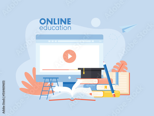 Online Education Concept with Computer Books and Graduation Cap
