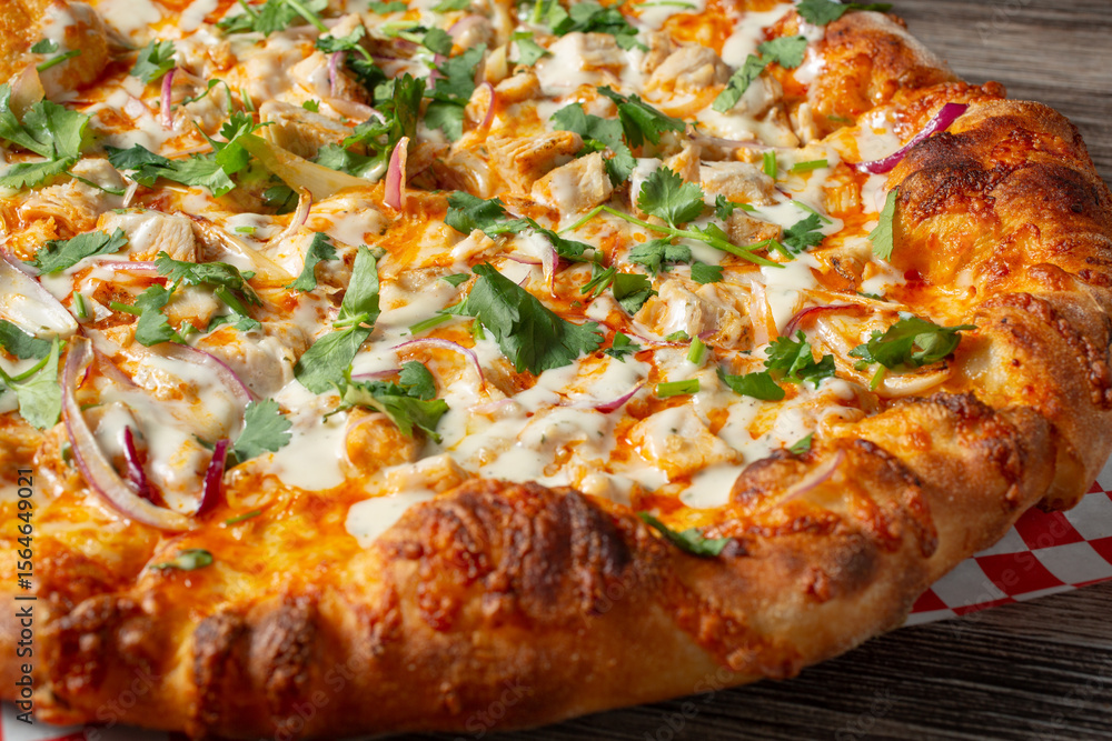 A closeup view of a BBQ chicken pizza. A closeup view of a BBQ chicken pizza.