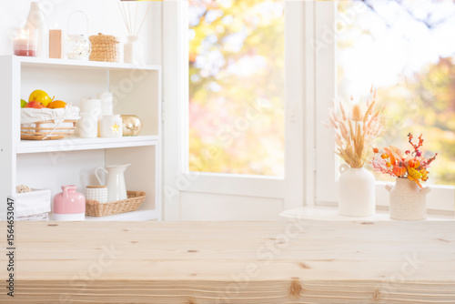 Tablou pe pânză Wooden texture table top on blurred background window sill and kitchen furniture