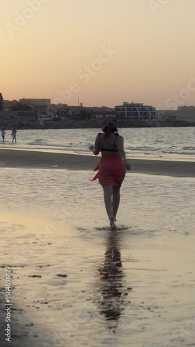Young Woman Running on the Beach