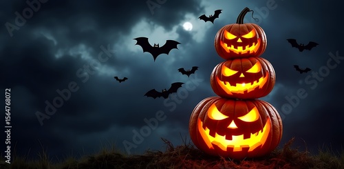 Stacked glowing jack o lanterns with bats flying in dark cloudy sky halloween pumpkin