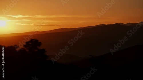 Wallpaper Mural Mountain Range Silhouette Glowing at Sunset with Orange Sky Torontodigital.ca
