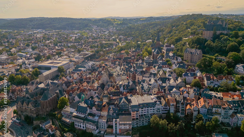 Fototapeta premium Aerial view of the old town of the city Marburg in Germany on an overcast day in afternoon