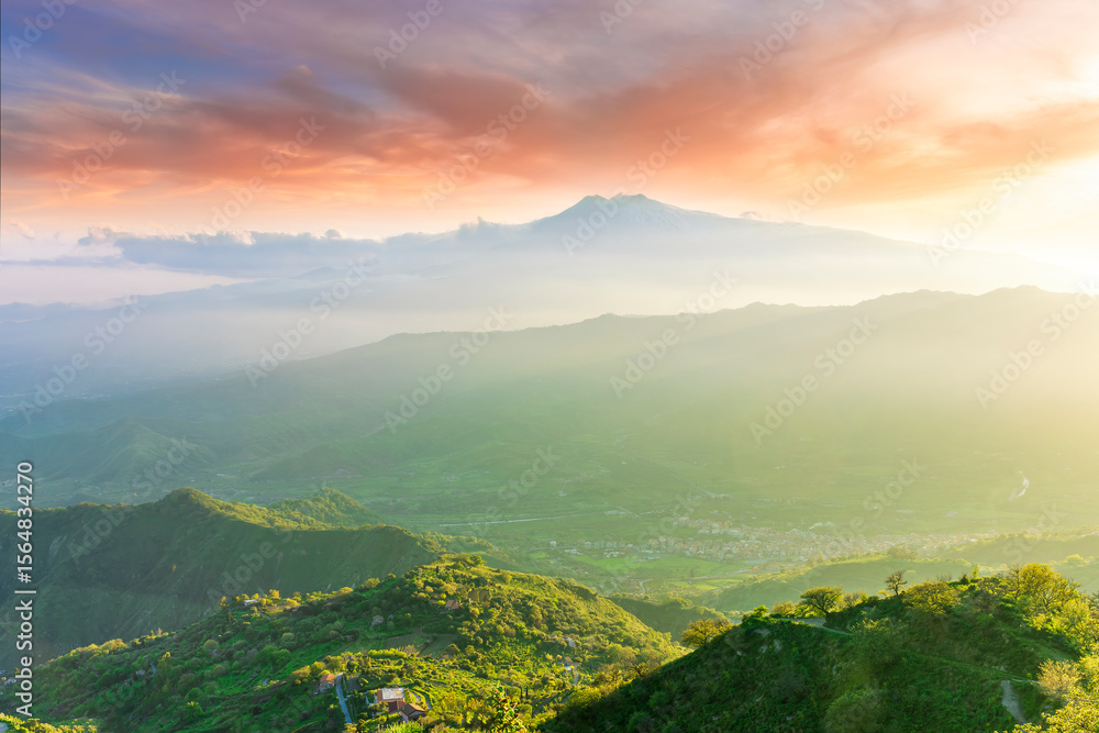 Fototapeta premium beautiful mountain sunset landcape with great magestic mountains and amazing slopes and canyons with evening clouds. Panorama of vulcano Etna in Sicily, Italy.