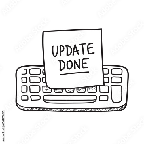 A sticky note that says update done placed on a keyboard