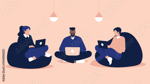 Three people working on laptops sitting in beanbag chairs under hanging lights in a relaxed setting