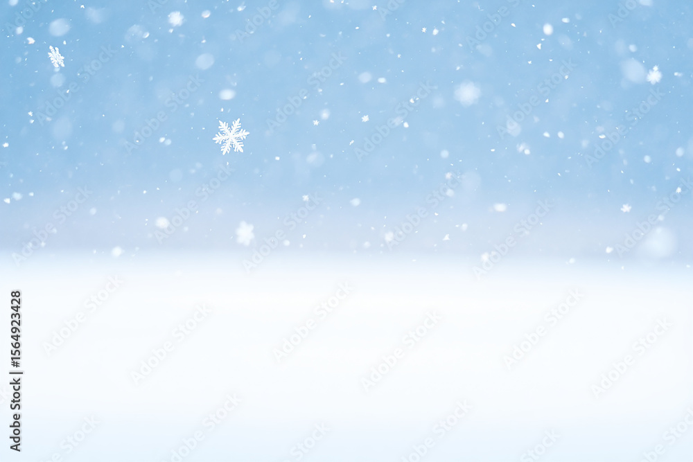 Gentle snowfall with clear snowflakes falling against a soft blue sky Gentle snowfall with clear snowflakes falling against a soft blue sky