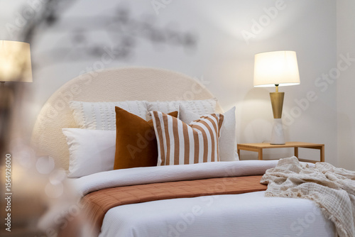 Styled Scene With Pillows Bedding And Wine