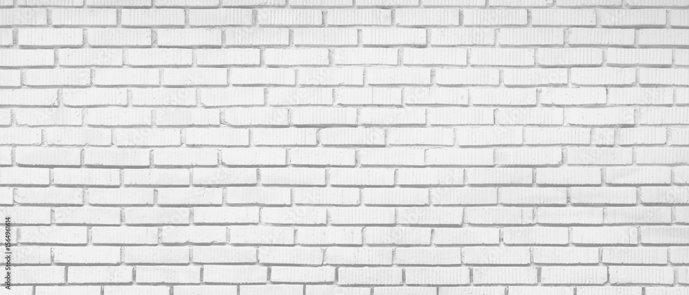 Fototapeta premium White brick wall with no visible writing. wall is made of white bricks. wall is very long and has no visible writing
